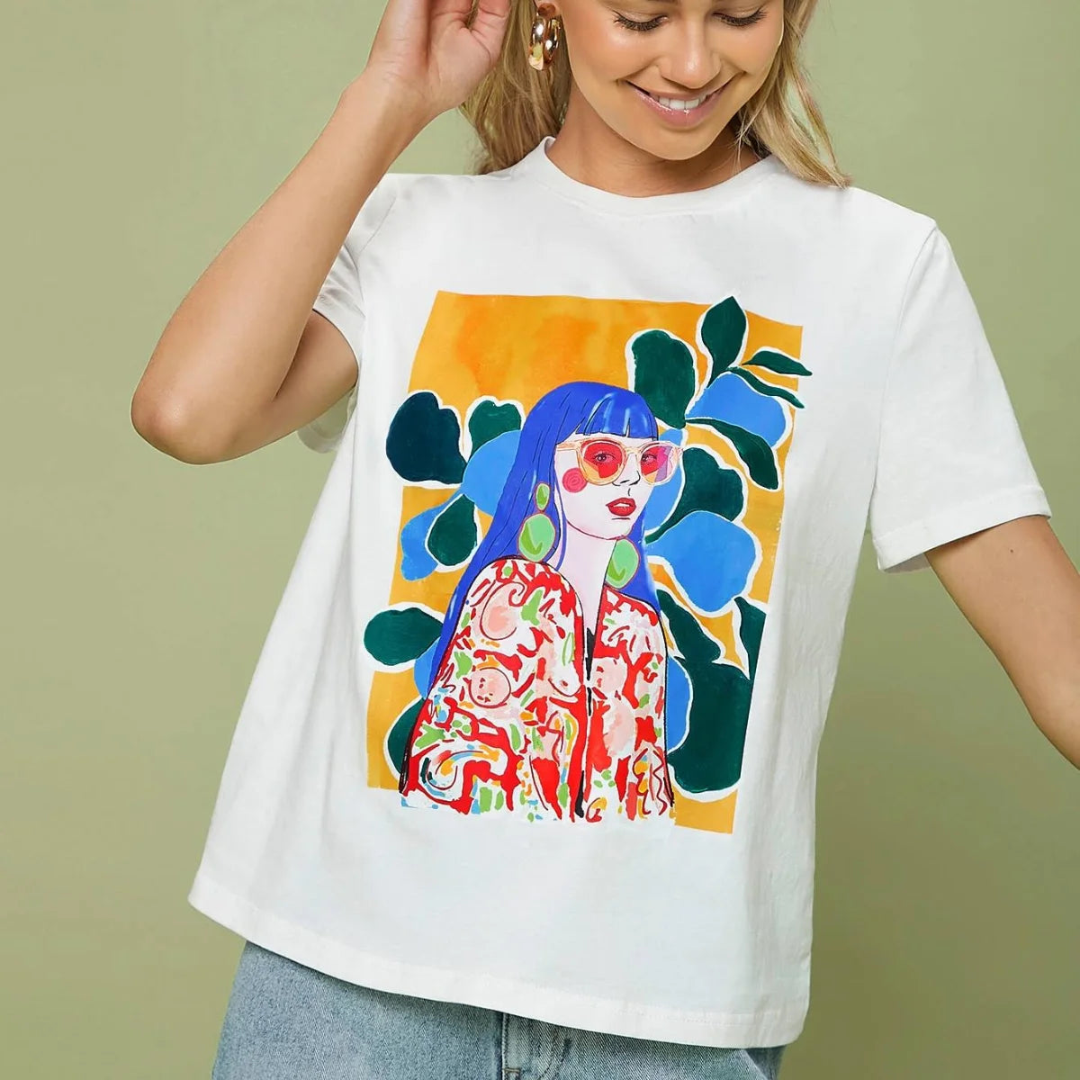 Woman wearing a white print on demand t-shirt with a colourful illustrated graphic design