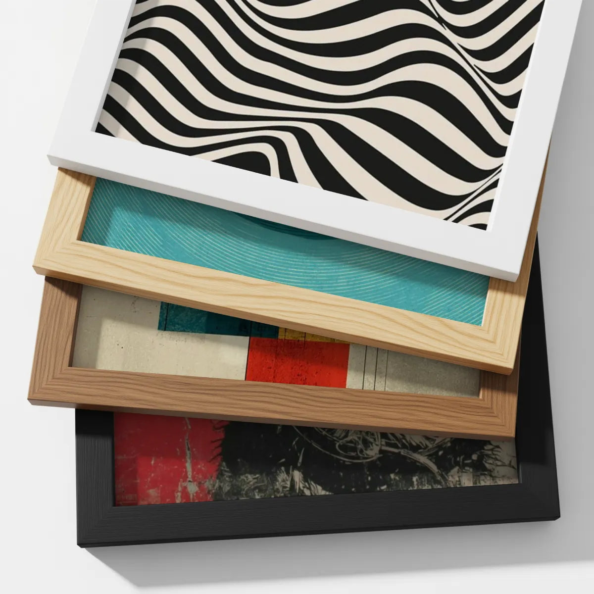 Custom print-on-demand framed poster available in black, white and natural wood frames, stacked to show frame colour options